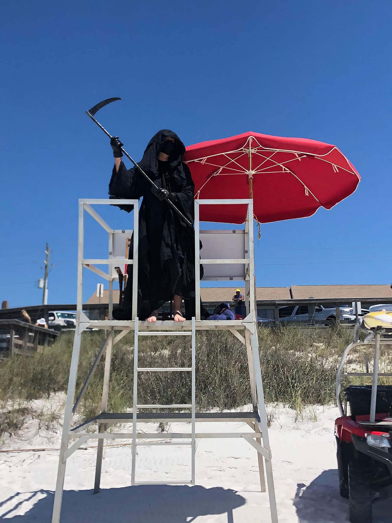 Lawyer dresses as the Grim Reaper to protest Florida’s open beaches