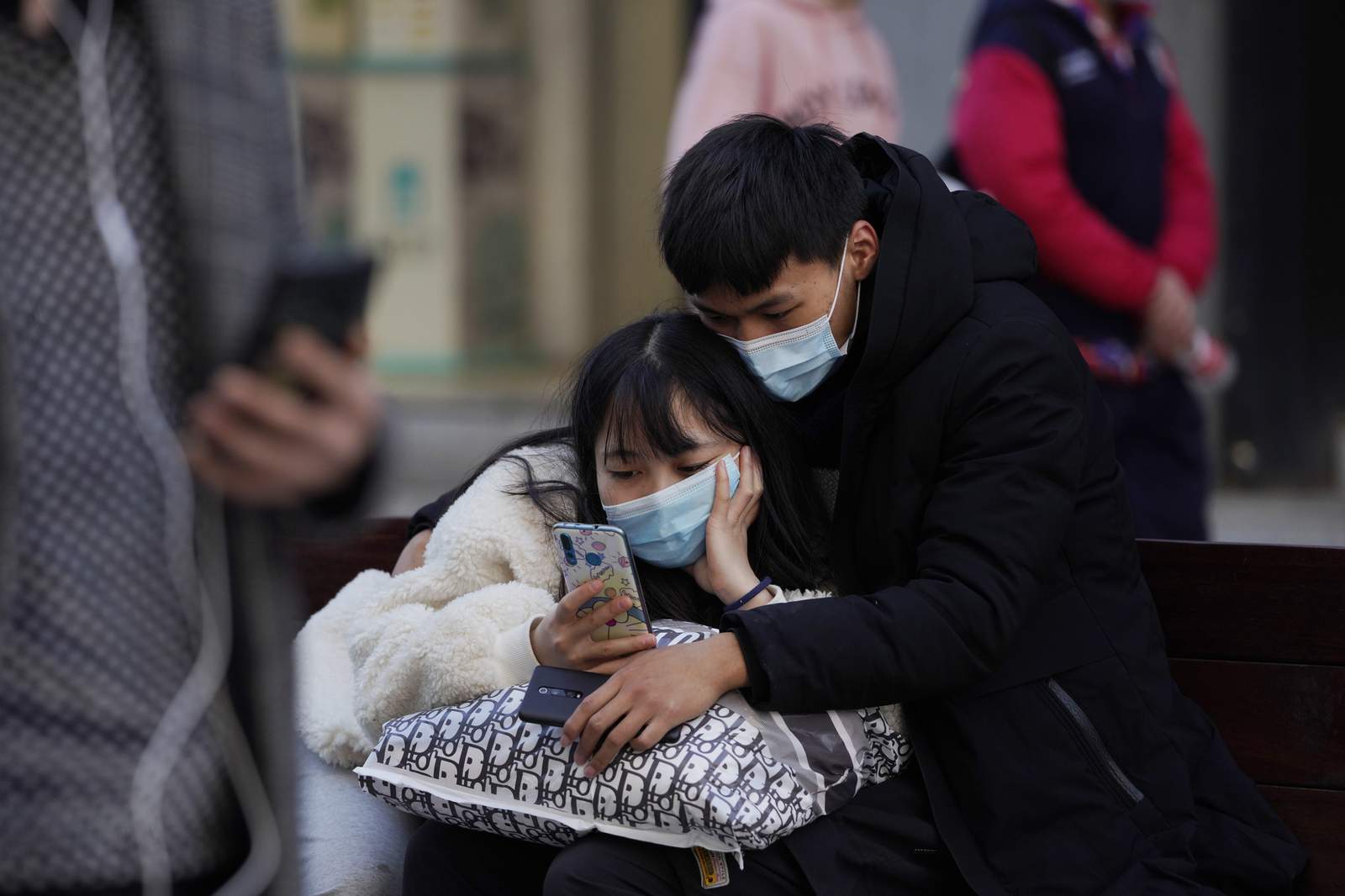 The Latest: China says COVID-19 hospitalizations above 1,000