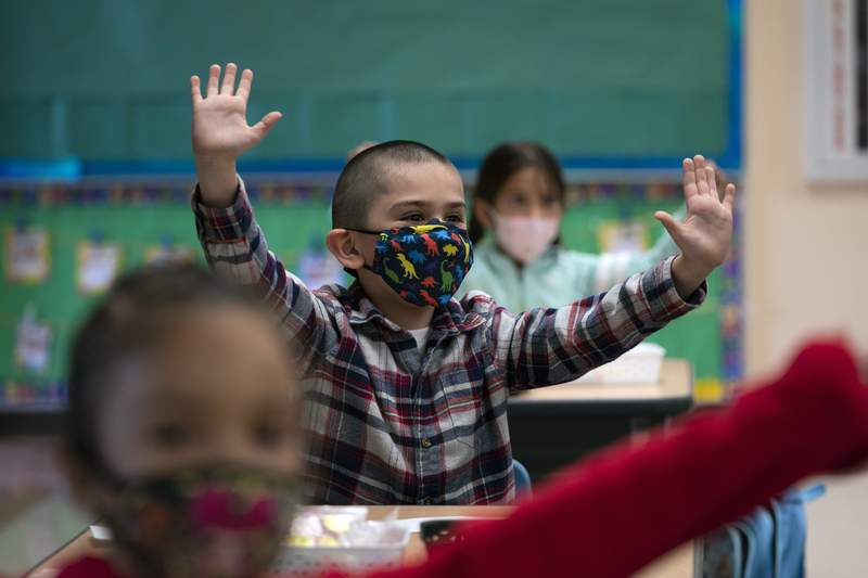 The Latest: California to require masks at schools in fall