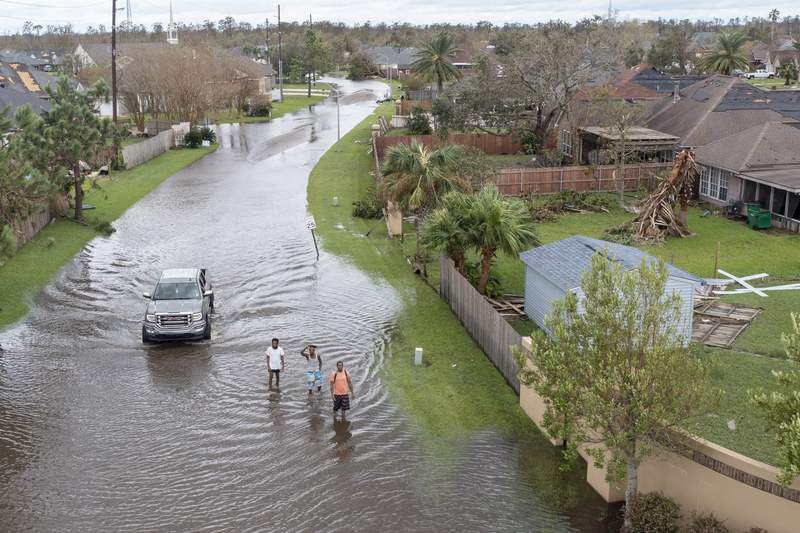 New Orleans levees pass Ida's test while some suburbs flood