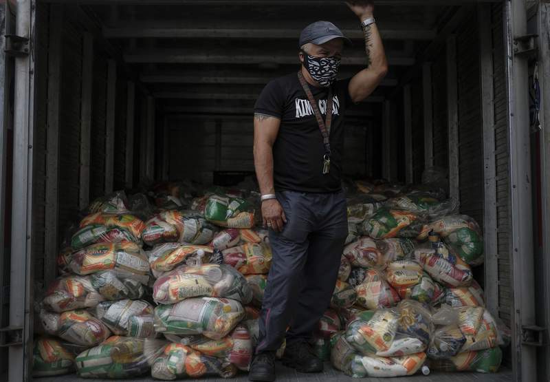 Venezuela's Maduro begins allowing aid against hunger, virus