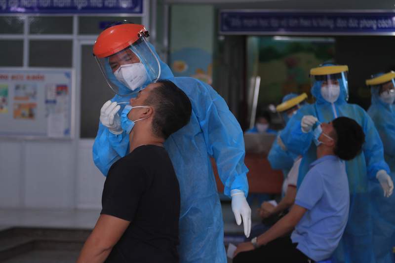 The Latest: Vietnam calls in army for strict virus lockdown