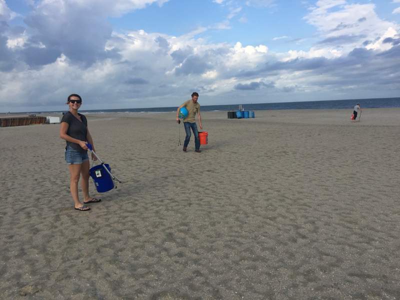 Georgia Power employees collect several gallons of trash at Tybee Clean Beach Project