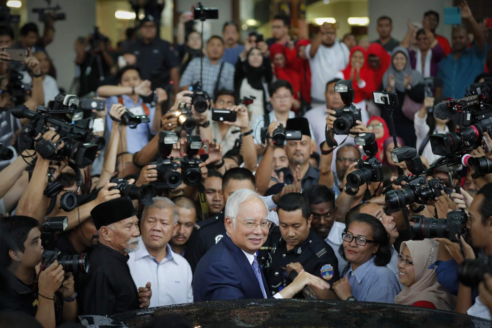 Malaysian ex-PM Najib arrives in court for graft verdict