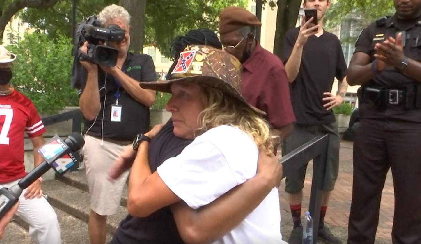 Street debate over Confederate monument removal ends with tears, hugs