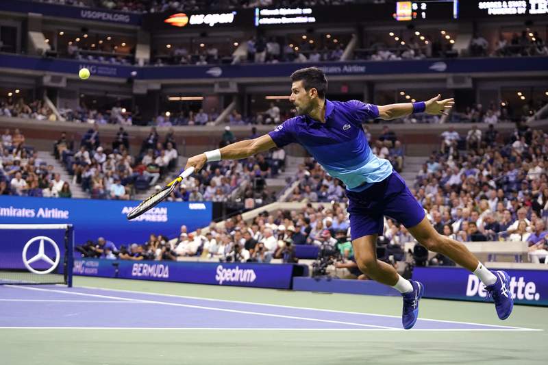The Latest: Djokovic a set away from US Open semifinals