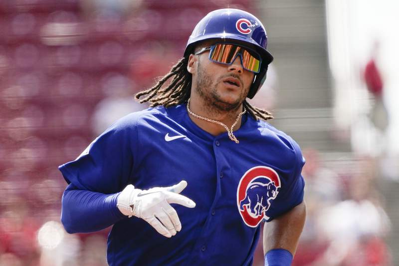 Depleted Cubs quiet playoff-contending Reds again, win 7-1