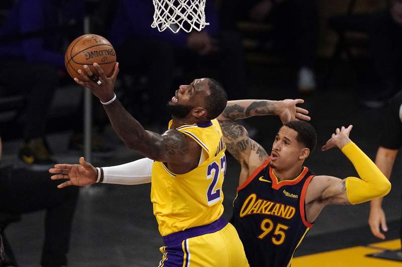 LeBron's 3 lifts Lakers over Warriors in West play-in game