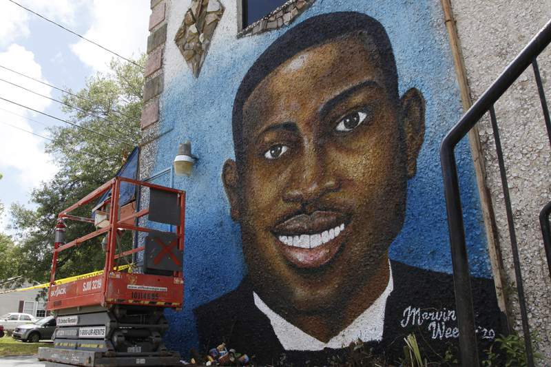 In this May 17, 2020, photo, a precocious    painted mural of Ahmaud Arbery is connected  show  successful  Brunswick, Ga., wherever  the 25-year-old antheral   was changeable  and killed successful  February. It was painted by Miami creator  Marvin Weeks. (AP Photo/Sarah Blake Morgan)