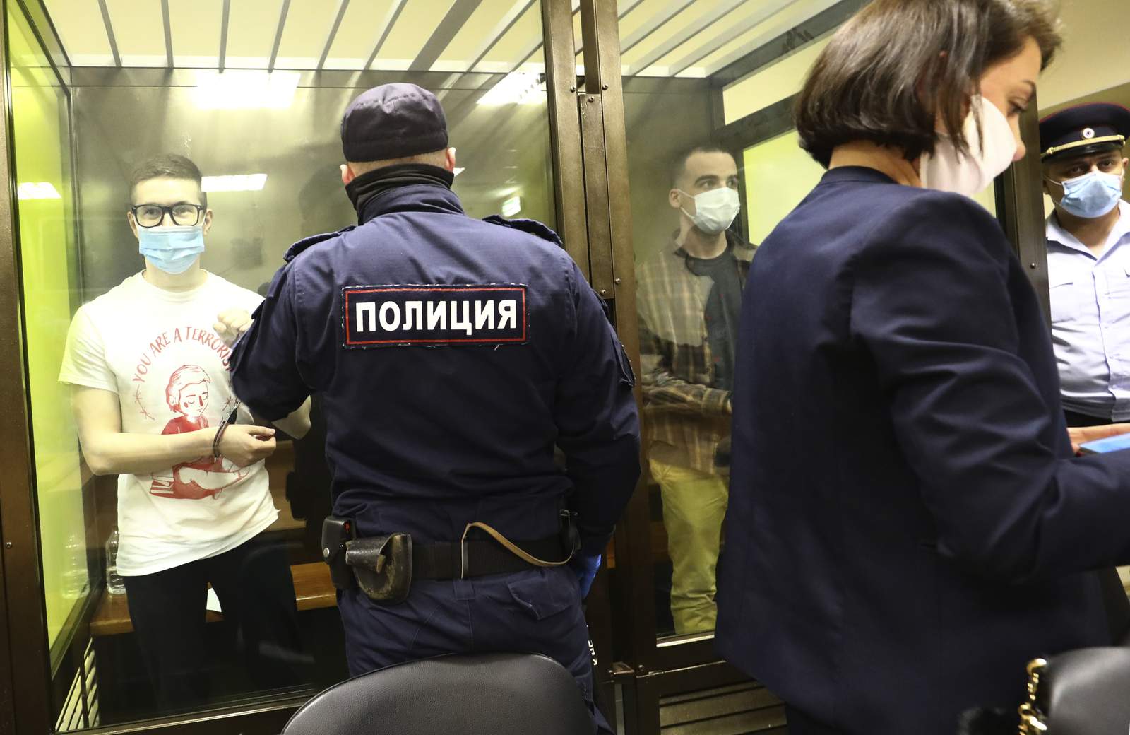 Russian court hands prison terms to youth group members