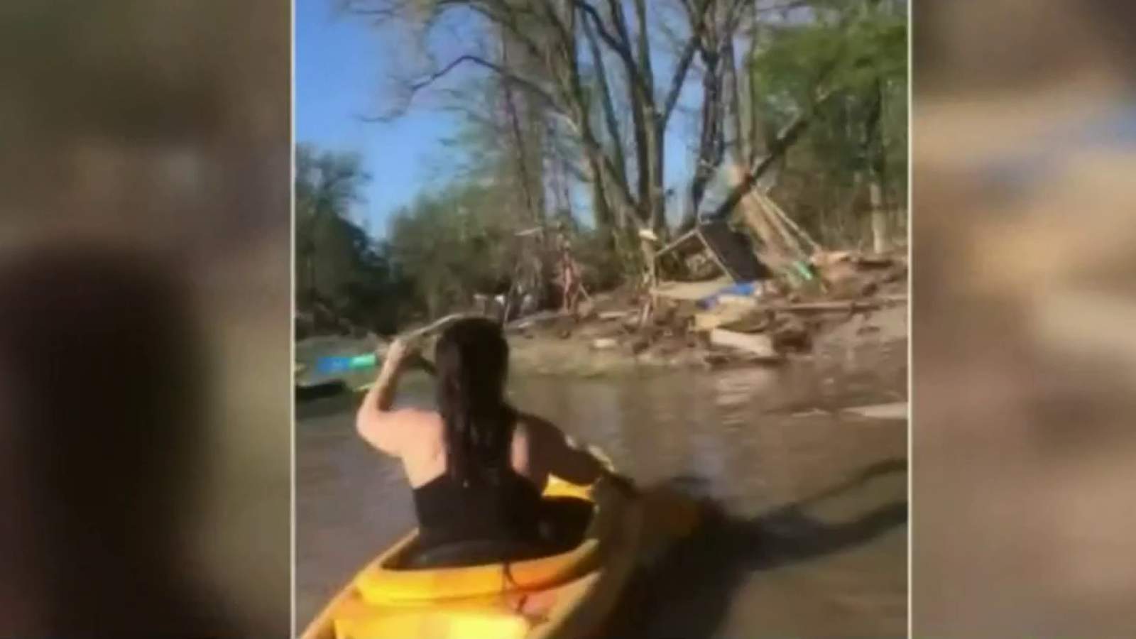 Woman kayaks to floating home swept away by flood to recover mother’s ashes