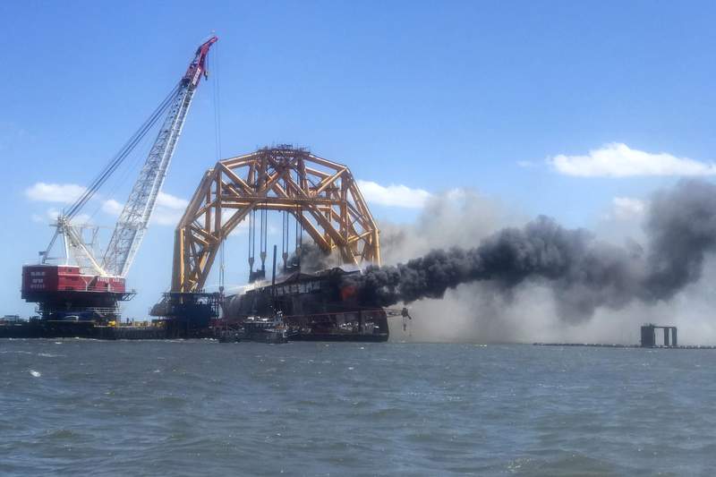 Flames engulf cargo ship's remains off US coast; no injuries