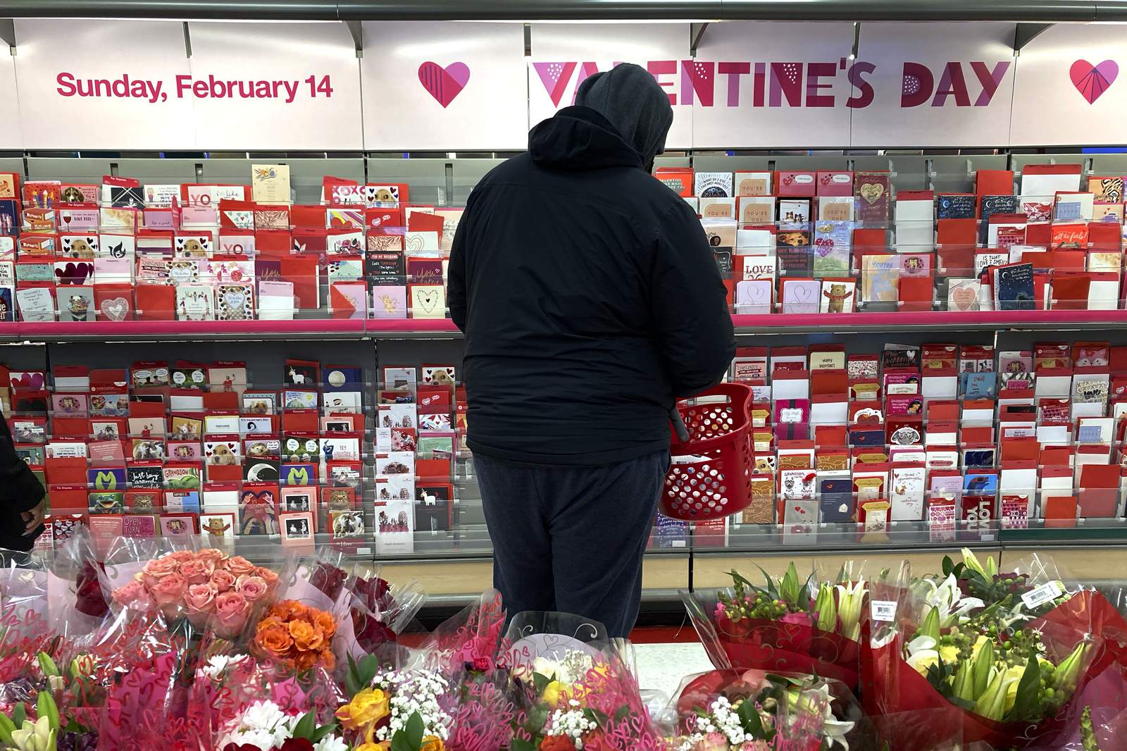A bleak Valentine’s Day, lovers find hope in roses, vaccines