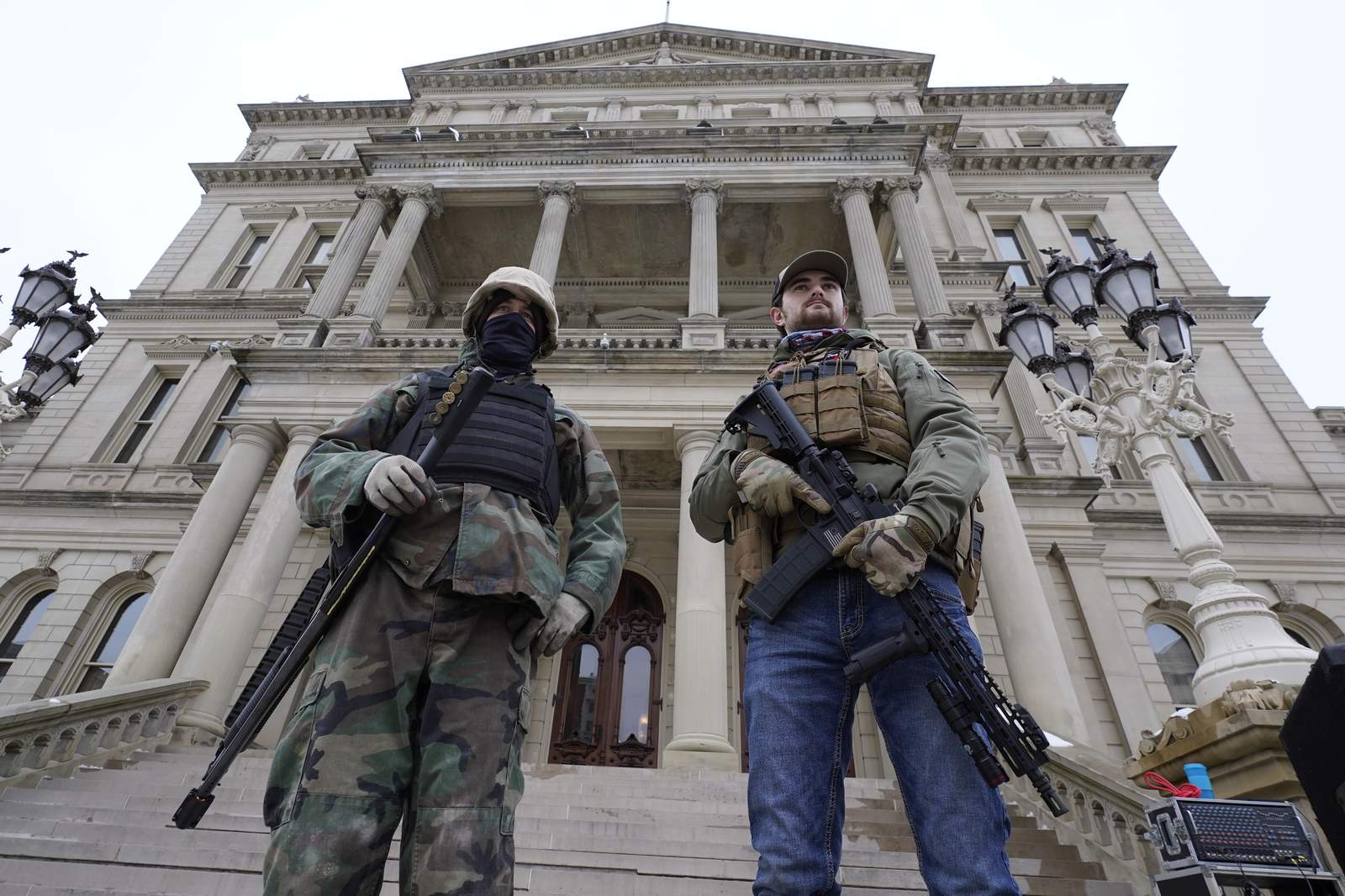 Guns in capitol buildings divide states after armed protests