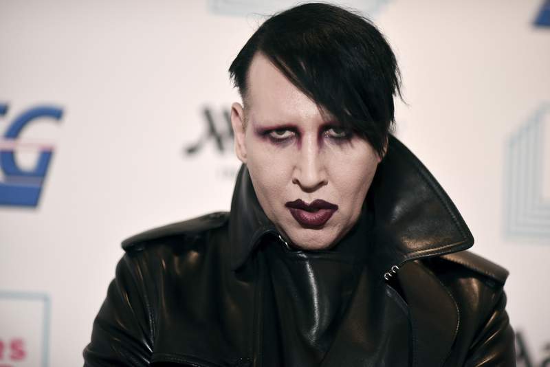 Rocker Manson accused of spitting, blowing snot on woman