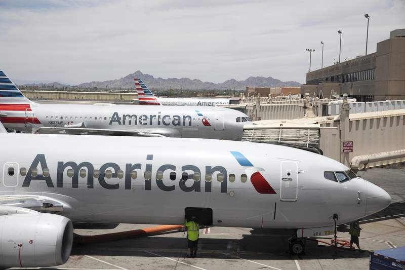 FILE - This June 7, 2021, record  photograph  shows an American Airlines craft  astatine  Phoenix Sky Harbor International Airport successful  Phoenix. (AP Photo/Jenny Kane, File)