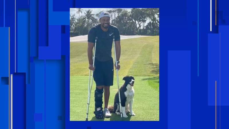 Tiger Woods, in cast & crutches, posts photo with dog in Florida