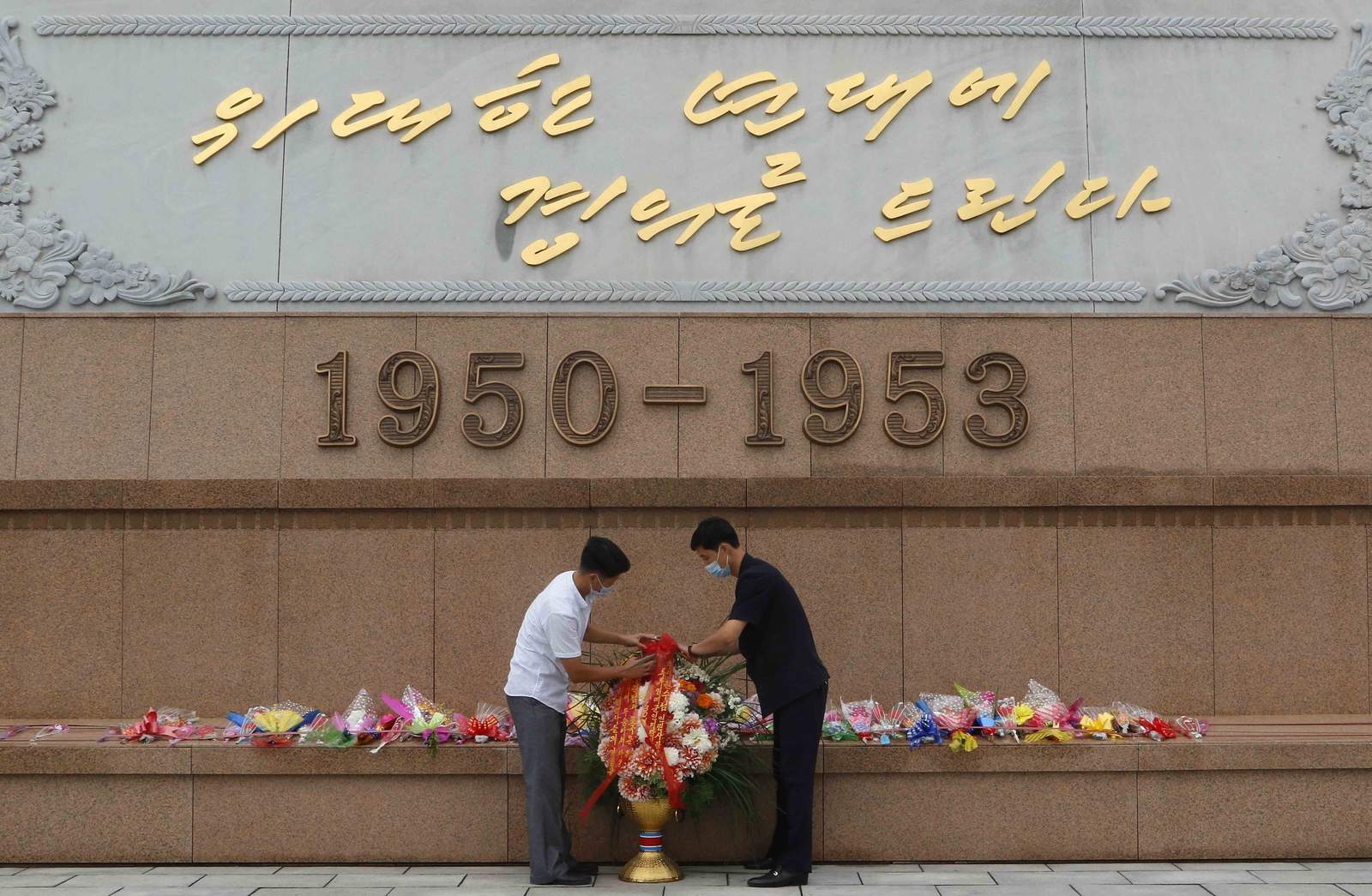 North Korea's Kim marks war anniversary amid virus concerns