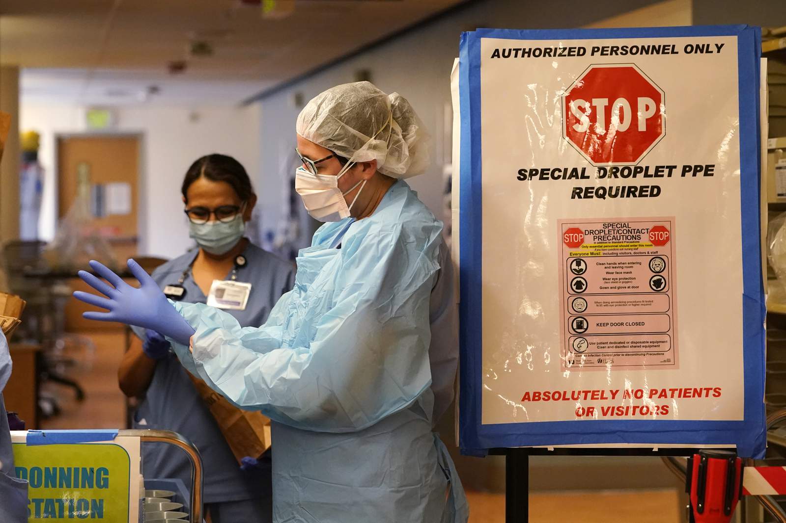 The Latest: Wash. state warns hospitals on VIP vaccinations