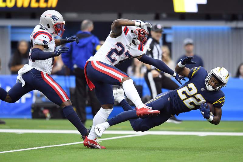 The Latest: Chargers take 7-0 lead on Patriots