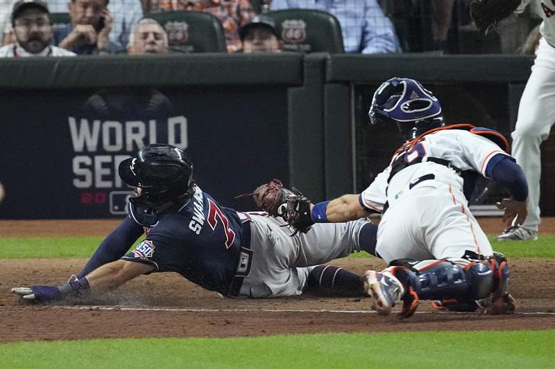 The Latest: Braves up 6-2, one inning away from Game 1 win