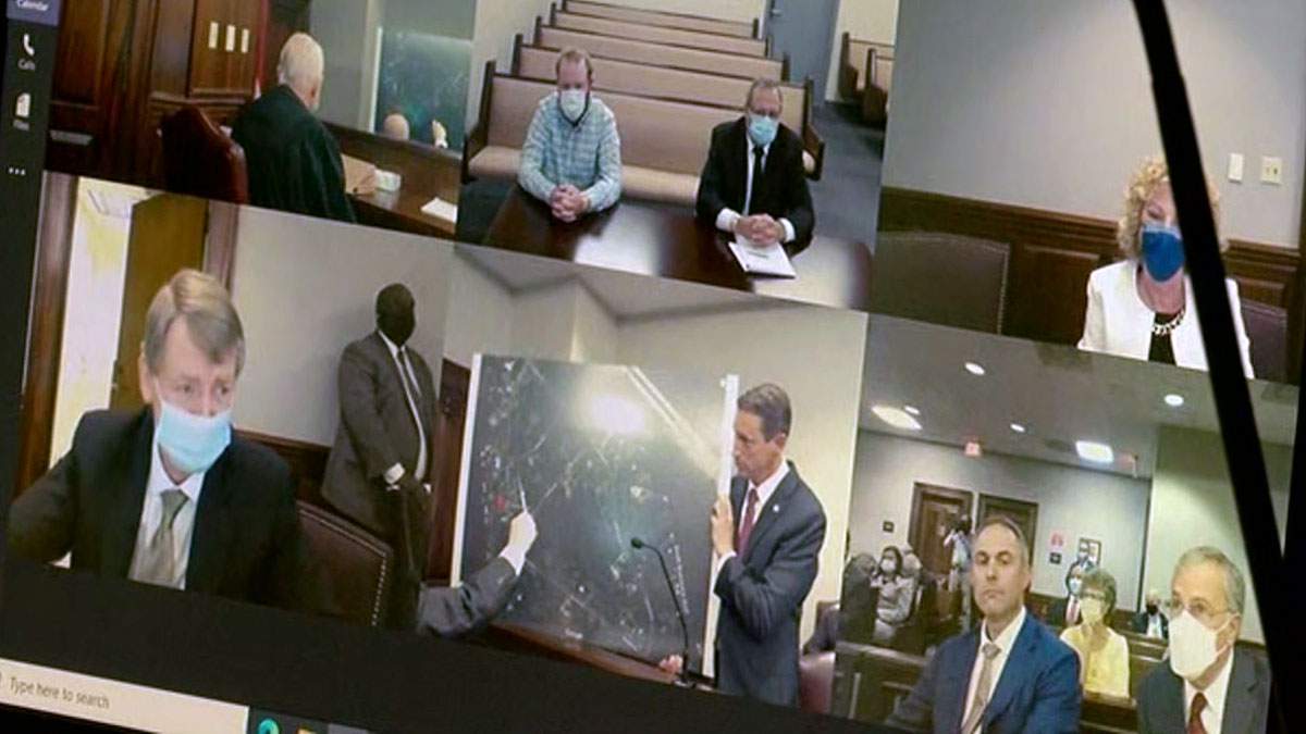 A preliminary hearing of Arbery murder defendants last year conducted while Travis McMichael, Greg McMichael and William "Roddy" Bryan joining by video from jail due to coronavirus precautions. (WJXT)
