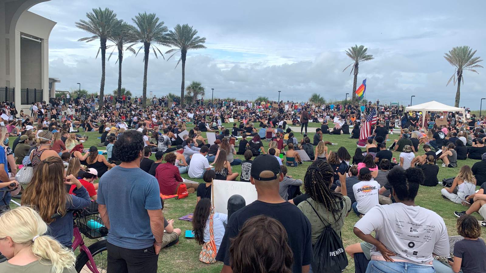 Demonstrators come together in Jacksonville Beach for a display of unity