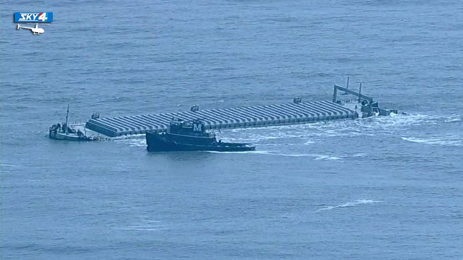 Massive barge still stranded offshore, south of the St. Johns River