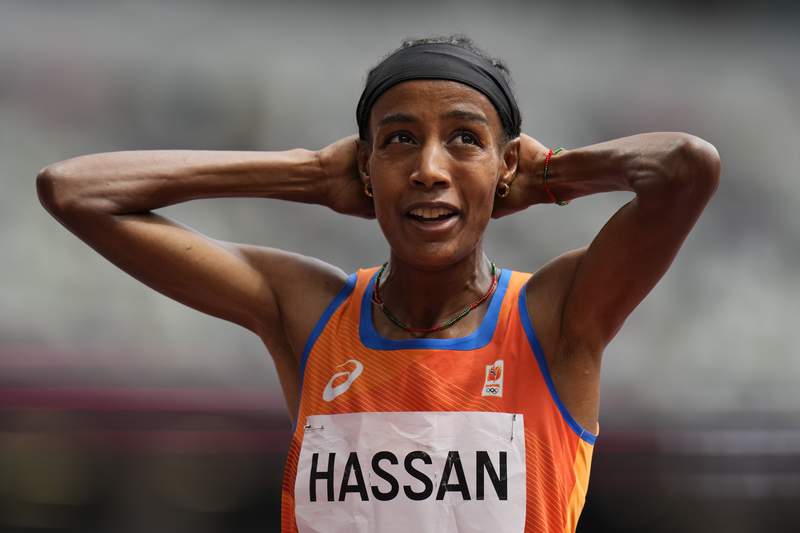 World champ Hassan falls, gets up and wins 1,500 heat