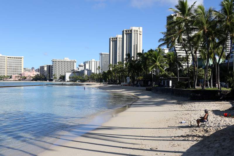 The Latest: Honolulu eases restrictions as vaccinations rise