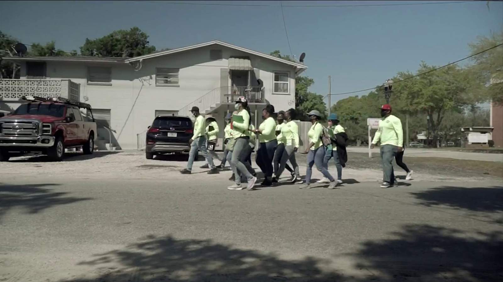 Workers go door to door in Jacksonville to sign up people for COVID-19 shots