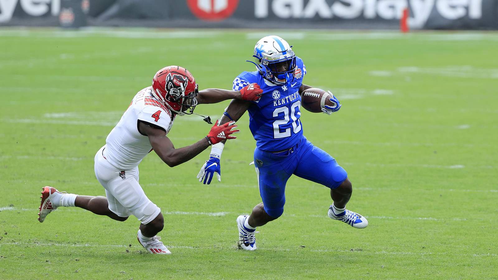 Kentucky runs for 281, beats NC State 23-21 in chippy Gator Bowl