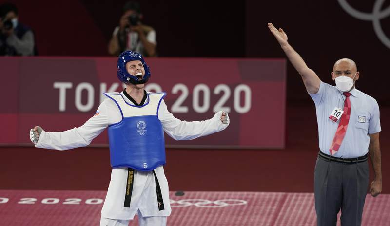 Olympics Latest: Larin wins gold in taekwondo
