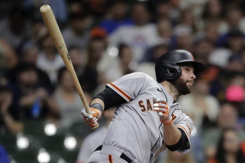 Belt homers twice as Giants outlast Brewers 9-6 in 11
