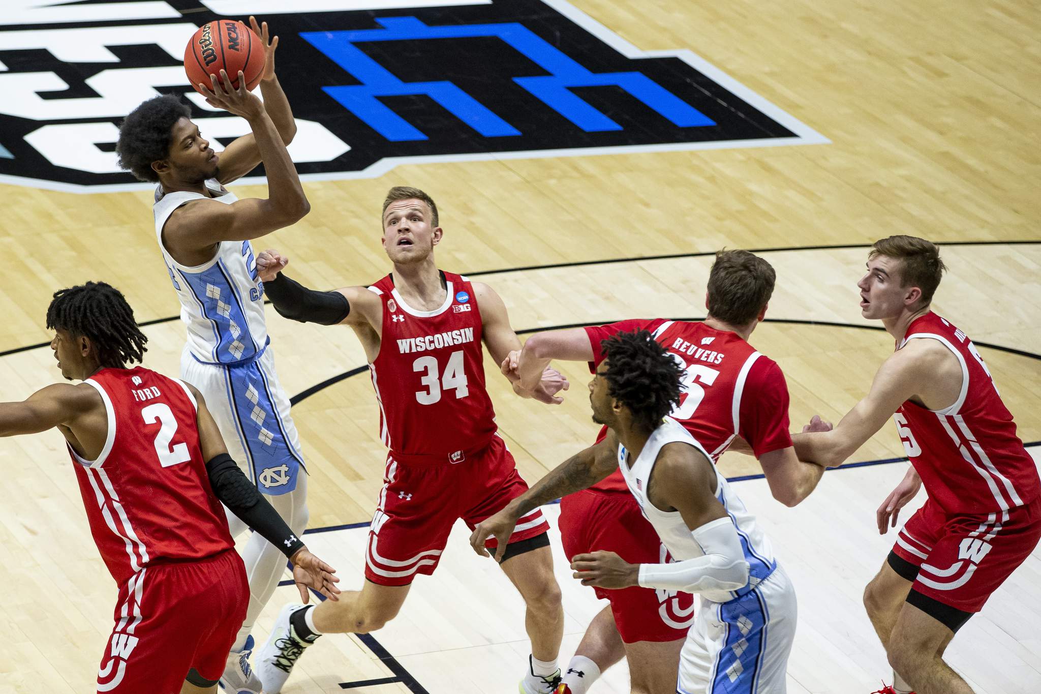 Wisconsin routs UNC, Williams falls to 29-1 in NCAA openers