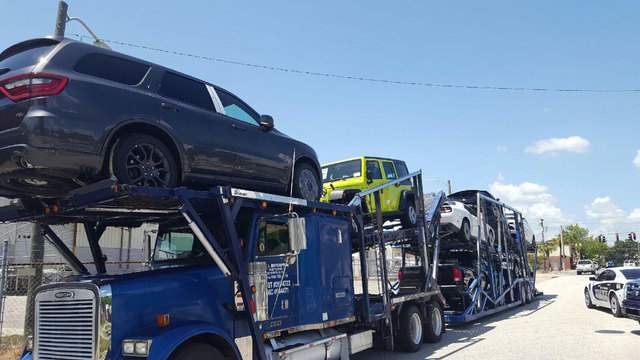 Car carrier yanks down wires, power poles in Starke