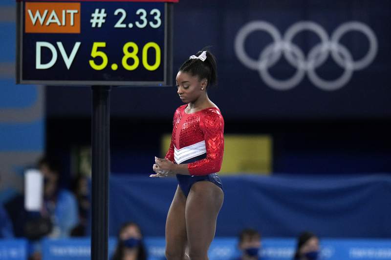 Biles out of vault and uneven bars; beam and floor possible