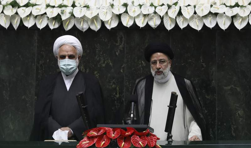 Iran swears in new hard-line president amid regional tension