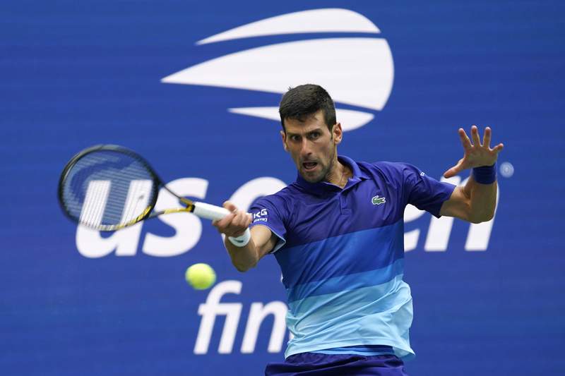 The Latest: Djokovic loses first two sets in US Open final