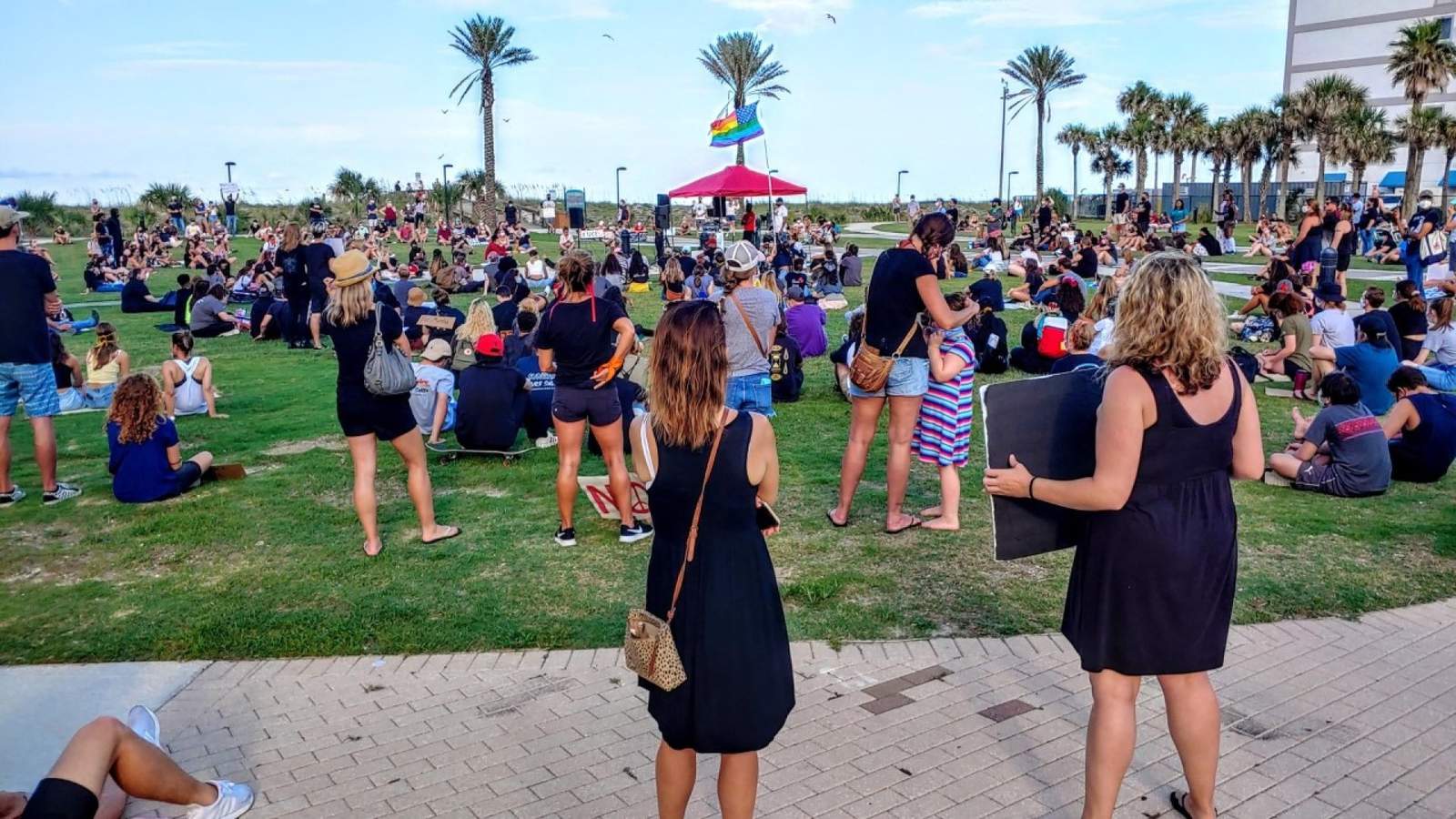 Demonstrators gather for a peaceful protest at the SeaWalk Pavilion