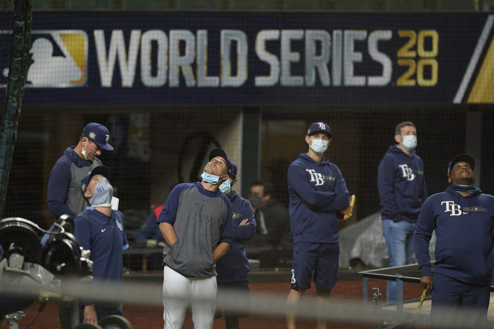 Few fans, masked umps, muted celebrations for World Series