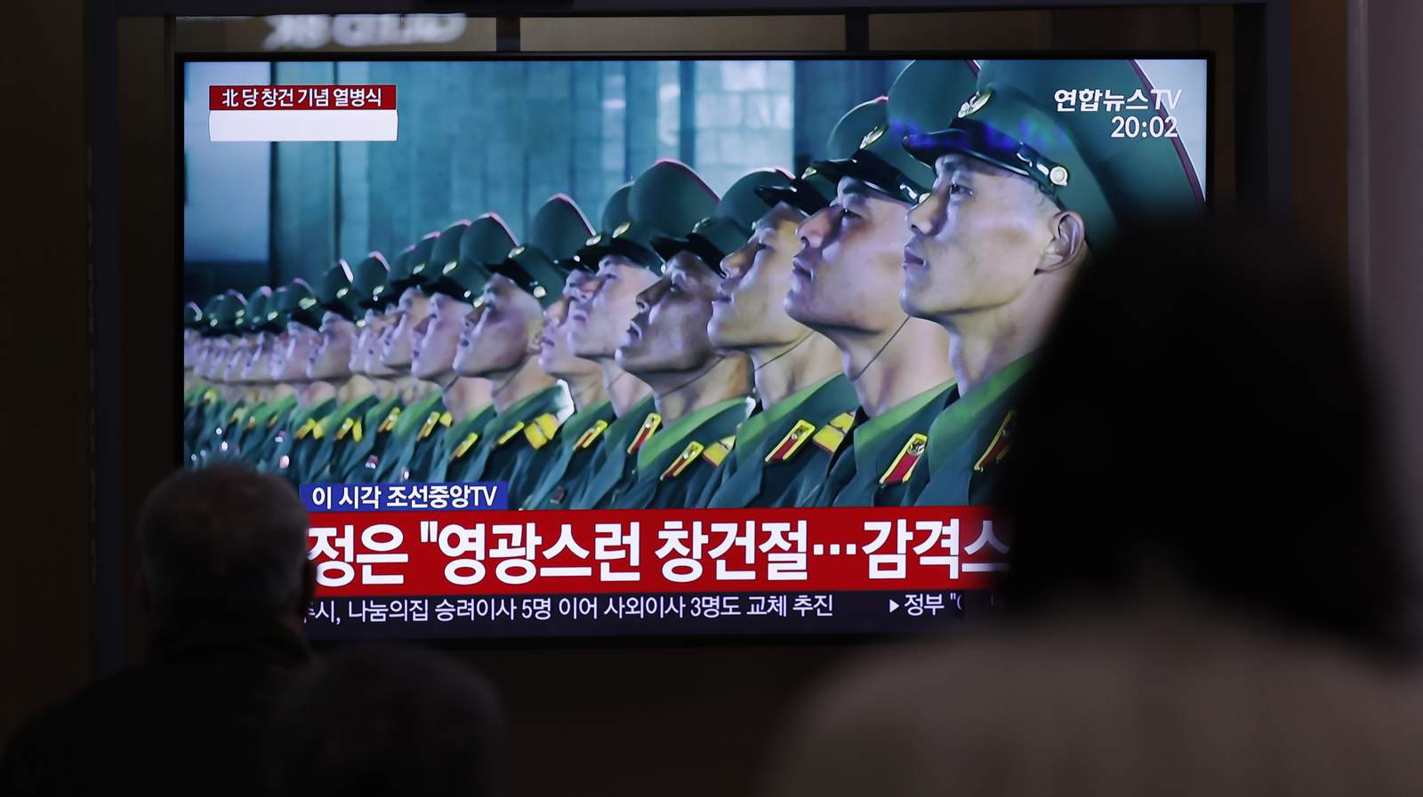 North Korea unveils new weapons at military parade