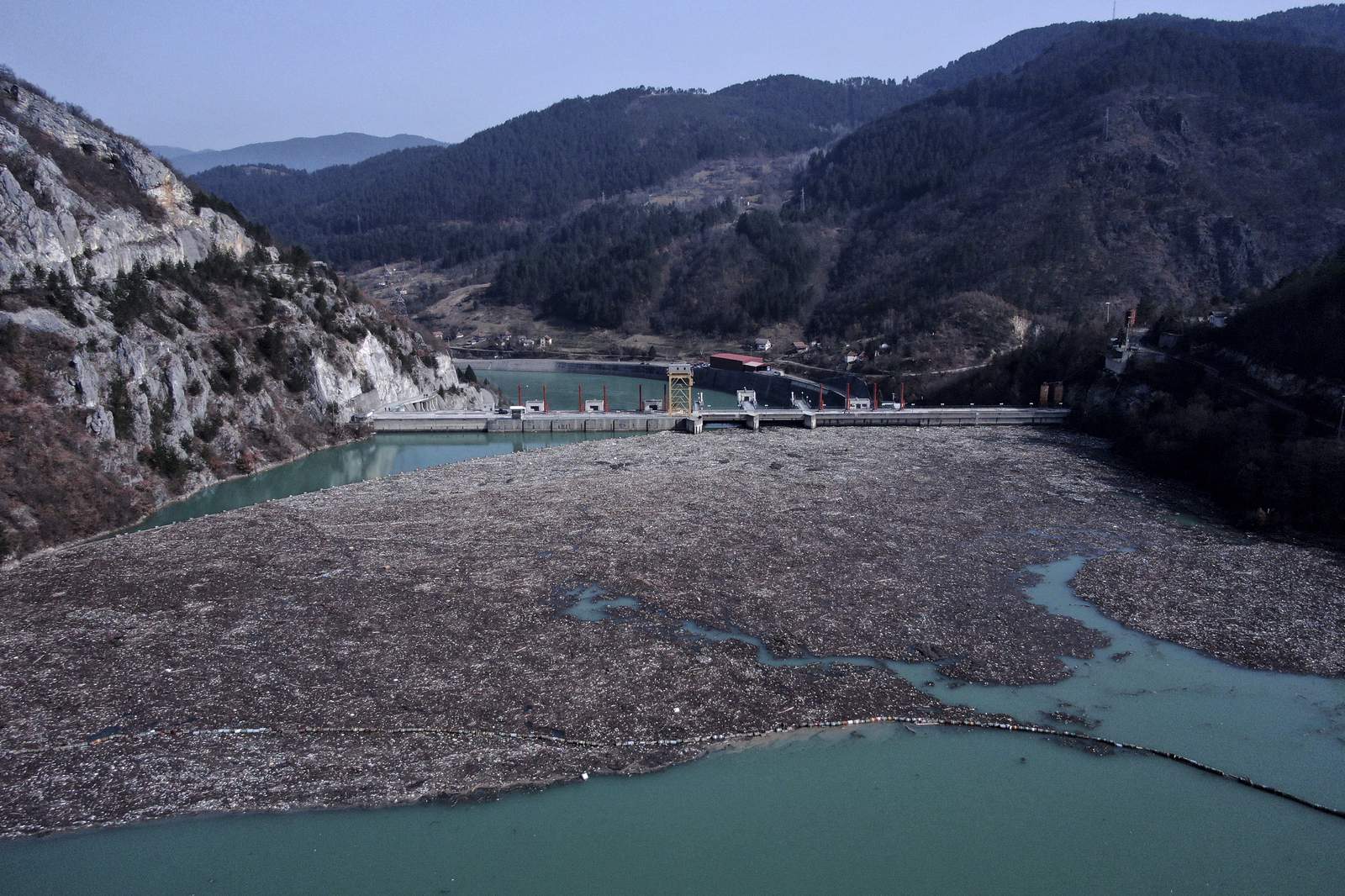 Trash fills Bosnia river faster than workers can pull it out