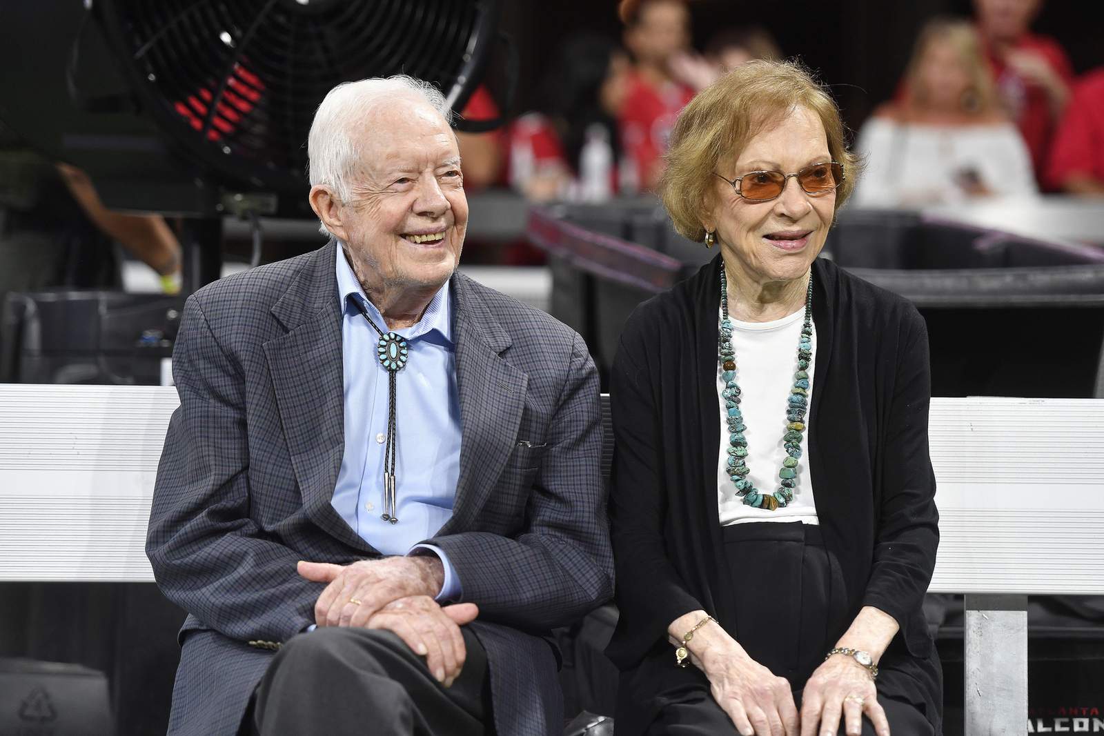 Vaccinated for virus, Jimmy Carter and wife back in church