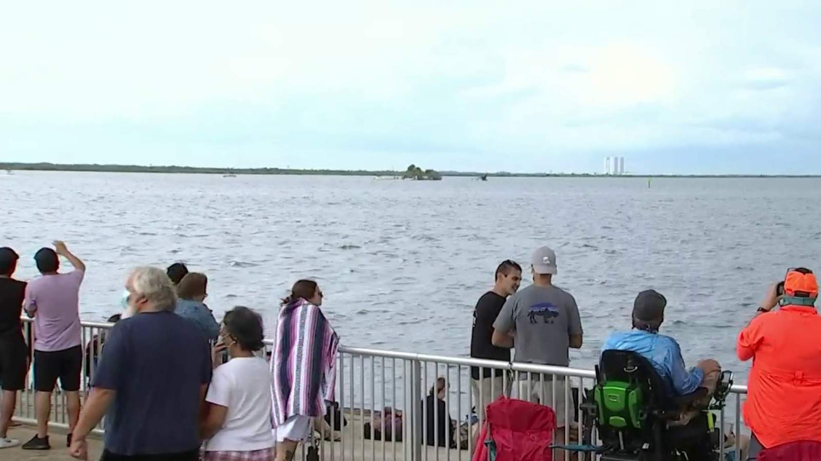 Launch watchers return for 2nd try with patience, umbrellas