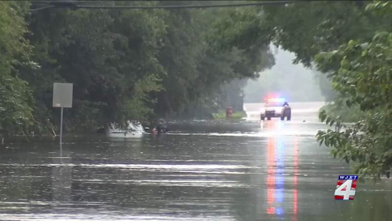 People rescued from flooding on roads Sunday afternoon