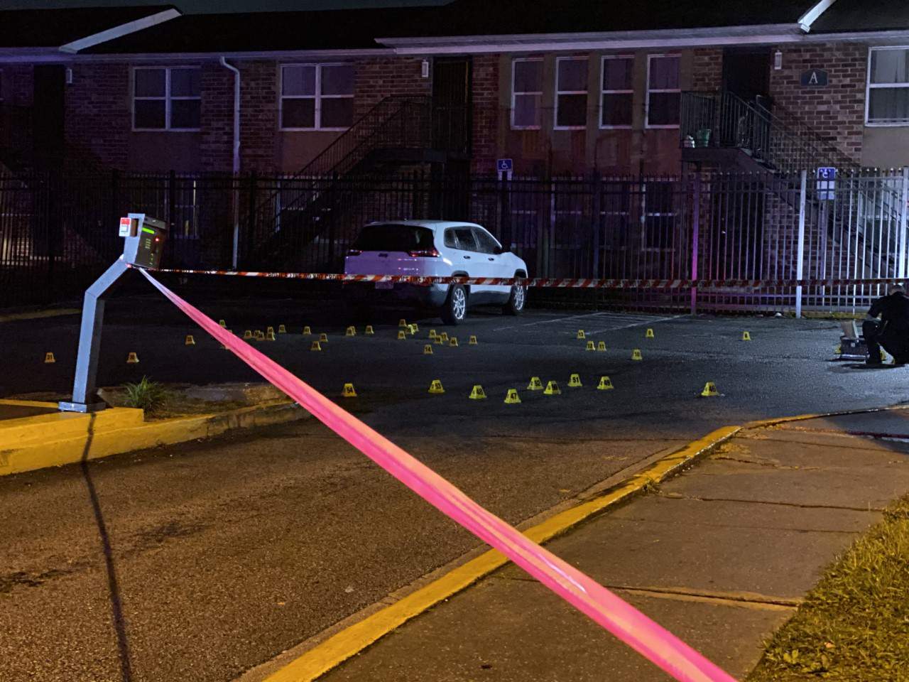 Slew of evidence markers line Hilltop Village parking lot after shooting
