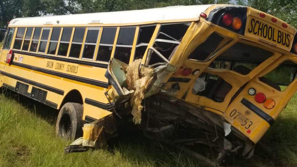 Police: Box truck rear-ends school bus, 1 dead, 7 injured