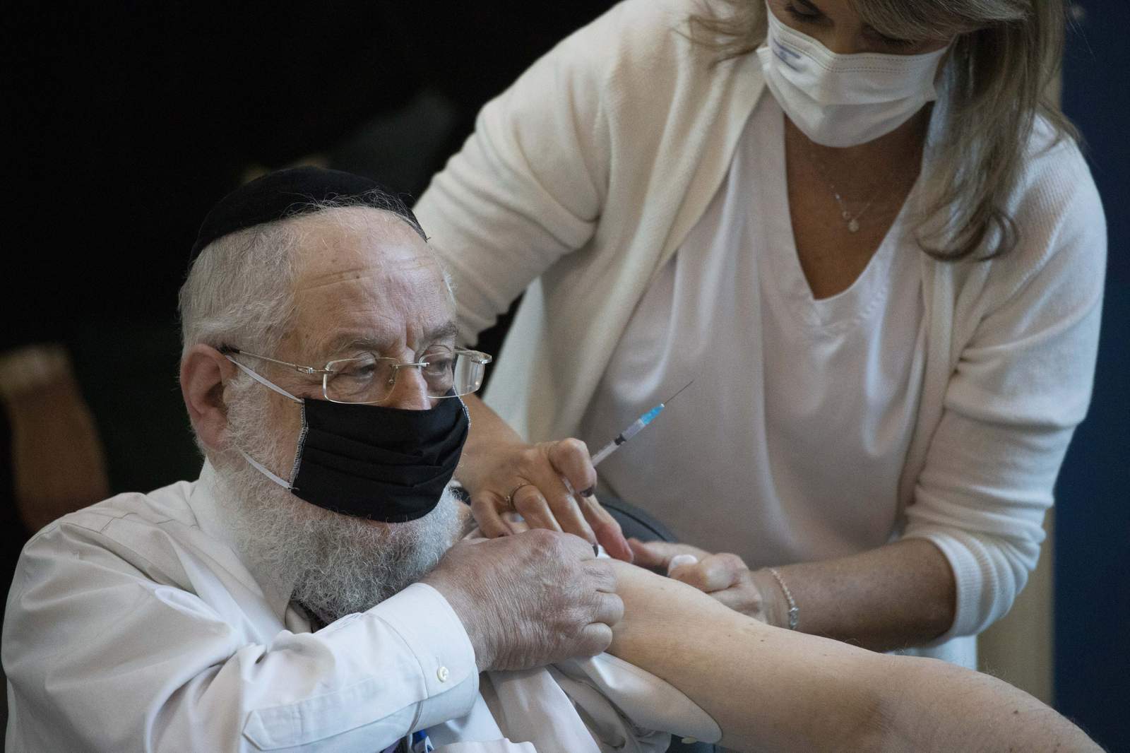 Israel begins virus inoculation drive as infections surge