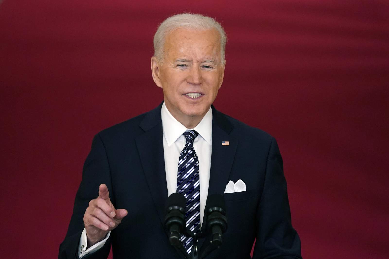 Biden aims for quicker shots, 'independence from this virus'